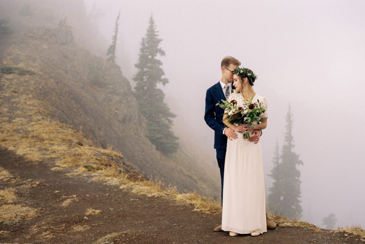 bride and groom in the fog